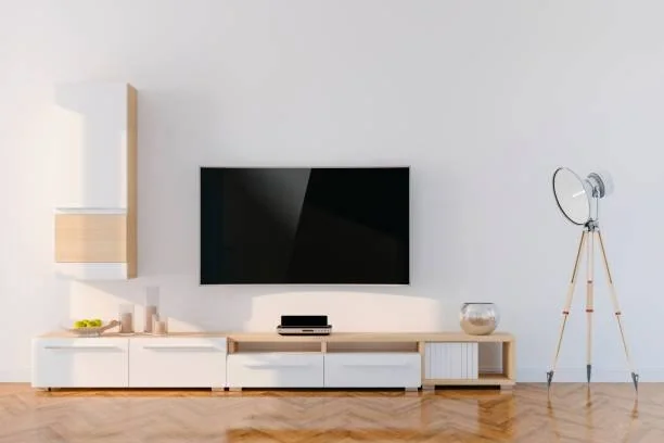 Electronics workbench with a flat screen television being repaired